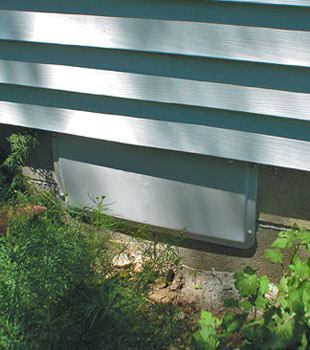 A gray crawl space vent cover in Athens