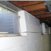 A foundation showing severe inward buckling along the windows in a Zanesville home.