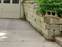a failing retaining wall around a driveway in Columbus