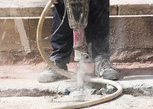 Jackhammering a slab floor in a Hilliard home.