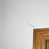 wall cracks along a doorway in a Athens home.