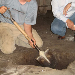 Digging a hole for the engineered fill used in a crawl space support system installation in Reynoldsburg