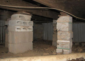 crawl space repairs done with concrete cinder blocks and wood shims in a Blacklick home