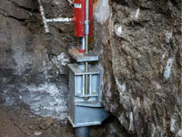 Foundation repair contractors lifting a structure in Lima.
