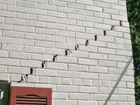 Stair-step cracks showing in a home foundation in Mount Vernon