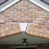 Major tuckpointing on a home archway over a door, with tuckpointing several inches wide that has failed on a Columbus home