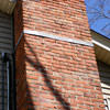 A tilting chimney on a Bellefontaine home with a leaning, tilting chimney that was temporarily repaired.