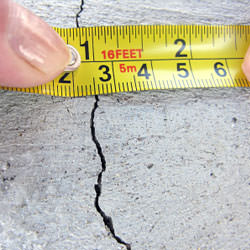 A crack in a poured concrete wall that's showing a normal crack during curing in Marietta