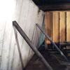 Temporary foundation wall supports stabilizing a Newark home