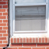 A gap in a window along the outer wall due to foundation settlement of a Athens home.