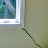 A long, diagonal crack that begins at a window corner of a Chillicothe home