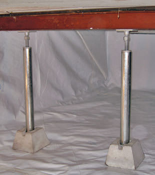Crawl space jack posts installed in conjunction with a crawl space vapor barrier in Circleville