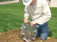Fastening an earth anchor for a severely bowing wall in Hilliard.