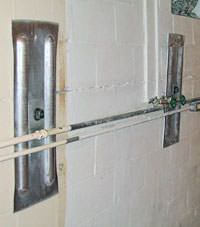 A foundation wall anchor system used to repair a basement wall in Etna