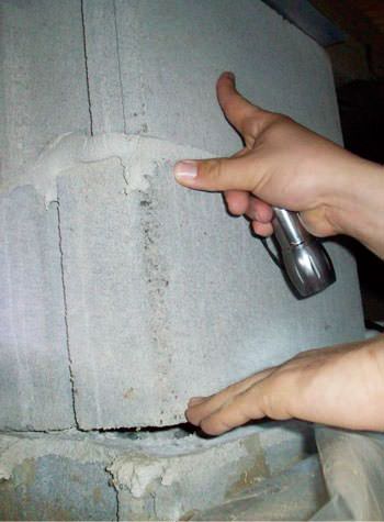 a completely failing concrete crawl space support pillar in Marietta