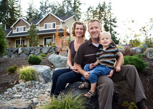 A happy family outside a home with a repaired foundation in Waverly