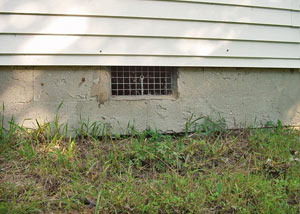 Open crawl space vents that let rodents, termites, and other pests in a home in Marion