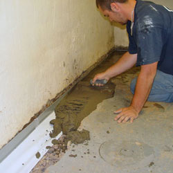 Testing a French drain system in a Mansfield home.