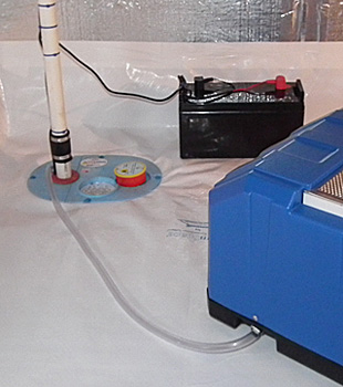 Closeup of a crawl space sump pump installed in Springfield