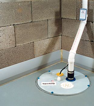 A baseboard basement drain pipe system installed in Mansfield