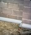 Our baseboard drain system installed on a corner in a Galloway basement.