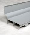 A closeup of our FlowGuard drain system for wet basements in Etna.