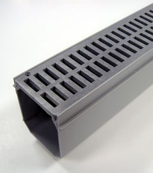 A closeup of our grated basement drainage pipe system, installed in Blacklick