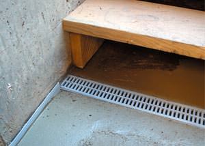 a hatchway entrance in Portsmouth that has been protected from flooding by our TrenchDrain basement drainage system.
