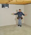 Newark basement insulation covered by EverLast™ wall paneling, with SilverGlo™ insulation underneath